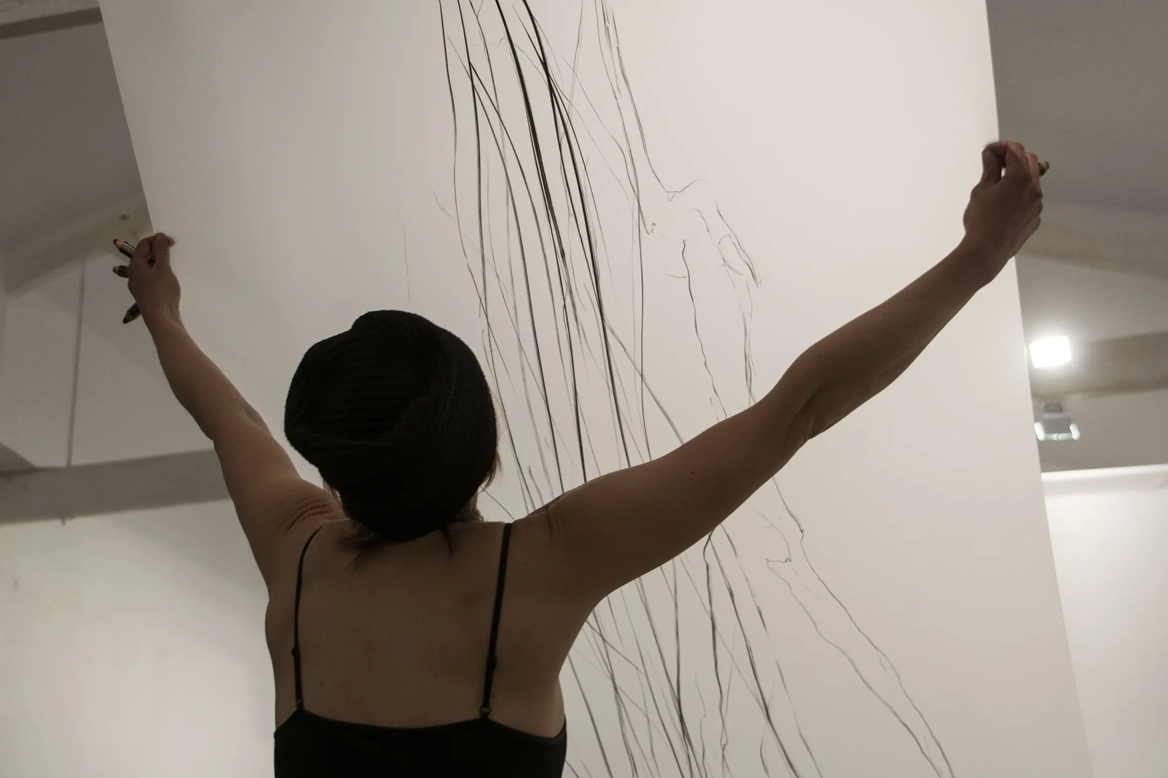 Flyer of the exhibition 'Not so Silent Ripples of Gravity' by Jaanika Peerna at Espronceda, art and culture center in Barcelona, featuring a drawing installation and collaborative performance with cellist Lucio Corrente.
